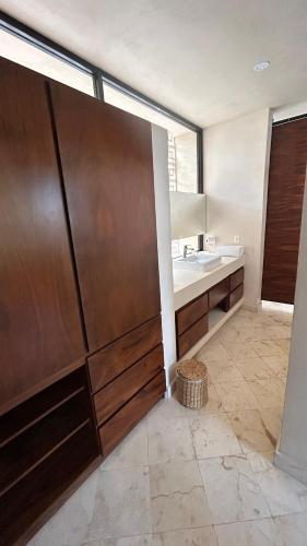 a bathroom with a sink and a mirror at IK Casa del viento in Chetumal