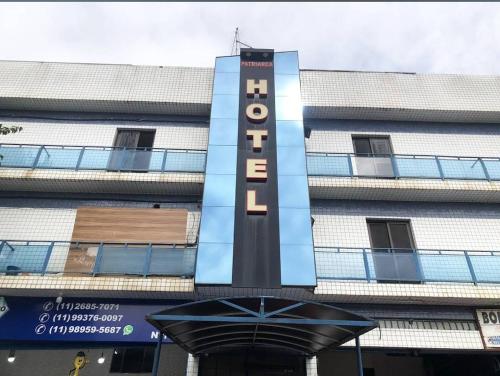 a hotel sign on the side of a building at Hotel Patriarca in Sao Paulo