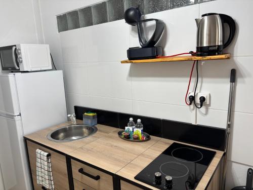Cuisine ou kitchenette dans l'établissement Lynn Lodge SLM