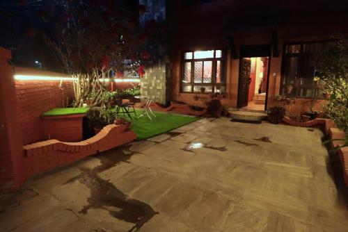 an empty patio in a house at night at Wanderer's Home Dhumbarahi in Kathmandu