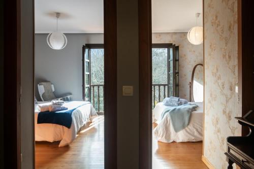 Ένα ή περισσότερα κρεβάτια σε δωμάτιο στο Vv Casa Güelu