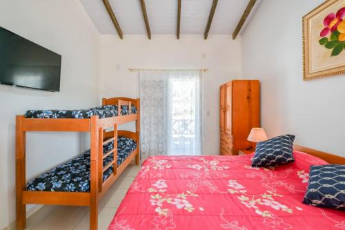 Кровать или кровати в номере Pousada Barra da Ferrugem