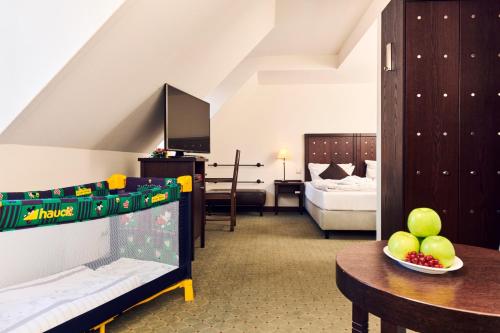 Postel nebo postele na pokoji v ubytování Best Western Soibelmanns Lutherstadt Wittenberg