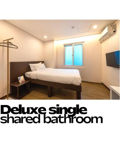 Letto o letti in una camera di CrashinYongsan guest house