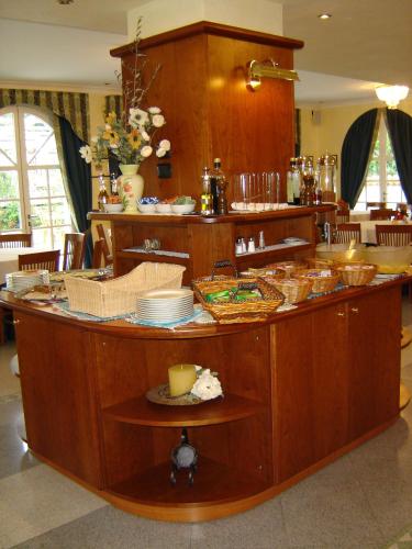 a kitchen with a counter with dishes on it at Hotel Lario in Mezzegra