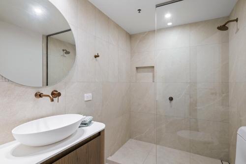 a bathroom with a sink and a shower at Character Central in Christchurch