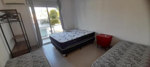 Postel nebo postele na pokoji v ubytování Casa Desejada na Morada da Praia