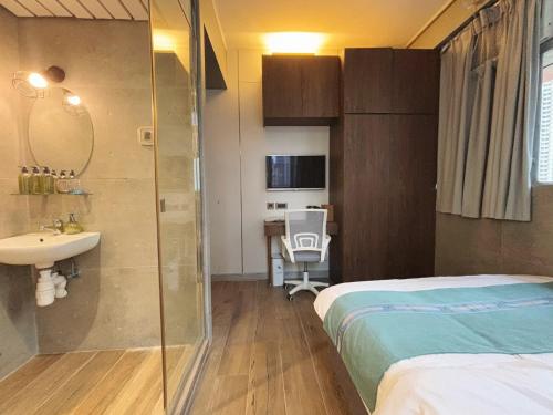 Postel nebo postele na pokoji v ubytování JST Hotel