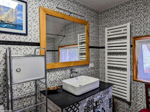 a bathroom with a sink and a mirror at Grande Maison Familiale Rénovée à Froideterre - FR-1-583-374 in Froideterre