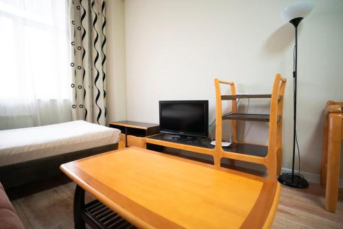 TV a/nebo společenská místnost v ubytování Tsolmon's Serviced Apartments