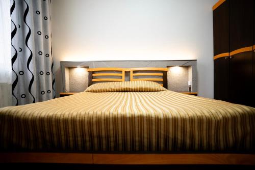 Postel nebo postele na pokoji v ubytování Tsolmon's Serviced Apartments