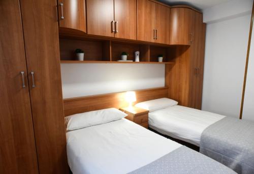 Postel nebo postele na pokoji v ubytování Encanto Puertochico - Céntrico y con Netflix gratis