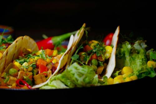a plate of food with vegetables and chips at Sheraton Poznan Hotel in Poznań