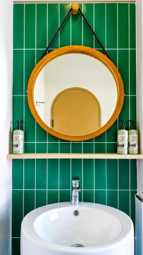 a bathroom with a sink and a mirror at Moonlight Kohlarn in Ko Larn