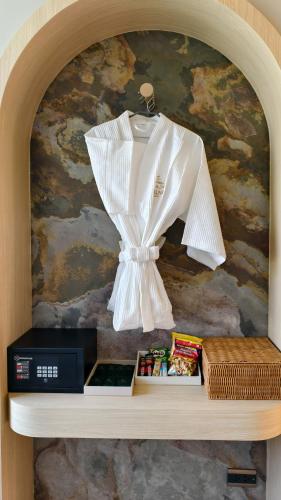 a white shirt on a hanger on a shelf at Moonlight Kohlarn in Ko Larn