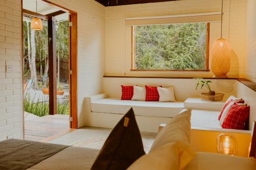 a room with a couch and a window at Recanto Alter do Chão in Alter do Chao