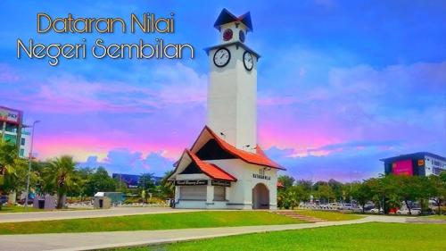 a lighthouse with a clock tower in a park at AL Rico Homestay KLIA SEPANG in Sepang