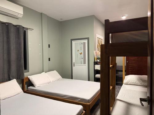 Postel nebo postele na pokoji v ubytování Uno Dus Tourist Inn