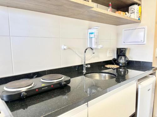 a kitchen with a sink and a counter top at Flat WiseSP - Expo Anhembi in Sao Paulo