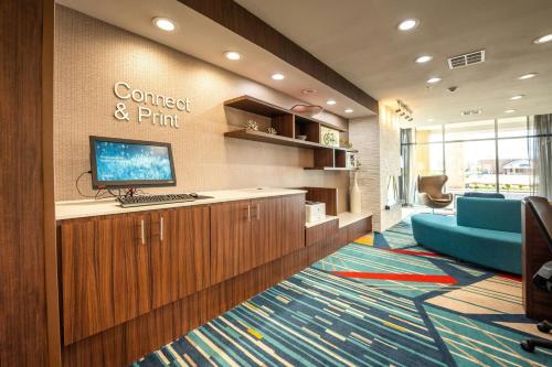 an office with a computer on a desk with a keyboard at Fairfield Inn & Suites by Marriott Huntsville in Huntsville