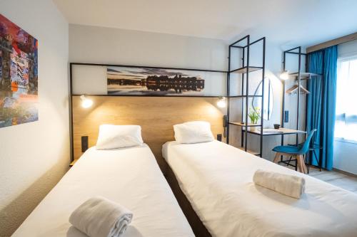 Postel nebo postele na pokoji v ubytování ibis Avignon Centre Pont De L'Europe