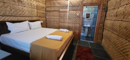 Cama o camas de una habitación en Tranquil Hampi