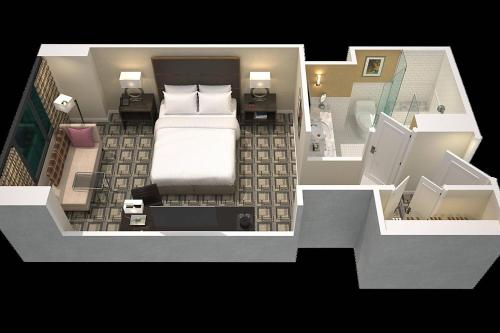 a rendering of a bedroom with a bed at Sheraton New York Times Square Hotel in New York