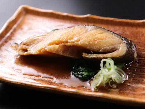 a piece of food on a plate with broccoli at Seaside Hotel Kujukuri in Sammu