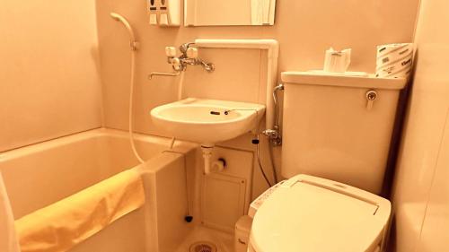 Koupelna v ubytování ロイヤルシティホテル Royalcity Hotel
