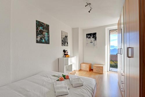 Postel nebo postele na pokoji v ubytování Lugano Bay View