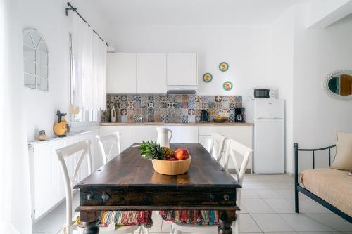 a kitchen with a table with a bowl of fruit on it at Coastal Key 3 in Gázion