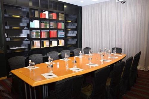 a conference room with a long table and chairs at Horizon Hotel in Kota Kinabalu