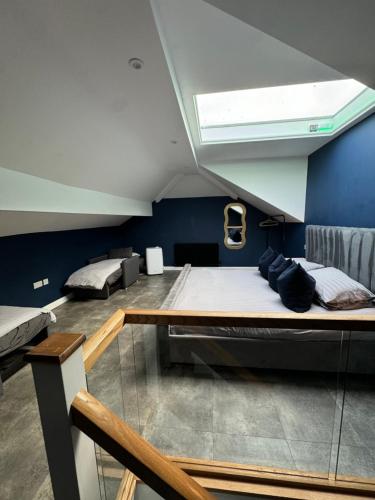 a room with two large beds and a window at terfyn hall holiday apartment 3 stargazer in Prestatyn