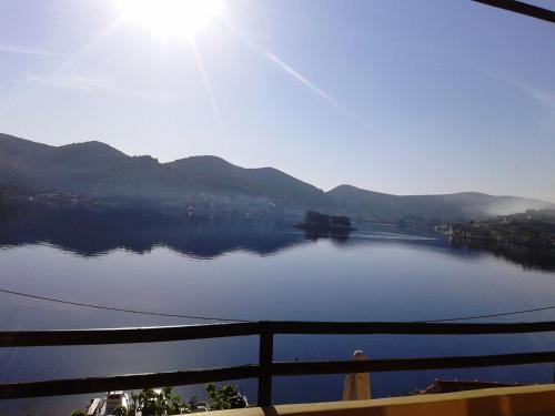 a view of a lake with mountains in the background at Levantes Houses in Vathi, Ithaka