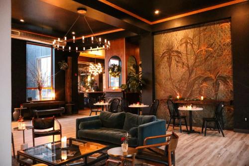 a living room with a couch and chairs and tables at Residence Inn By Marriott Philadelphia Bala Cynwyd in Bala-Cynwyd