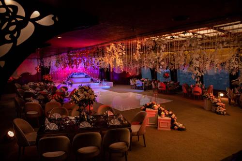 a banquet hall with tables and chairs and a stage at Hilton Cairo Grand Nile in Cairo