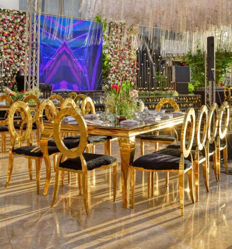 a dining room with a table and chairs at Hilton Cairo Grand Nile in Cairo