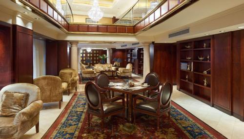 a living room with a table and chairs at Hilton Cairo Grand Nile in Cairo
