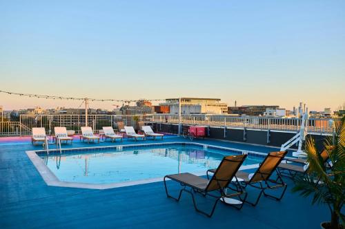 a swimming pool on the roof of a building at The Ven at Embassy Row, Washington, D.C., a Tribute Portfolio Hotel in Washington