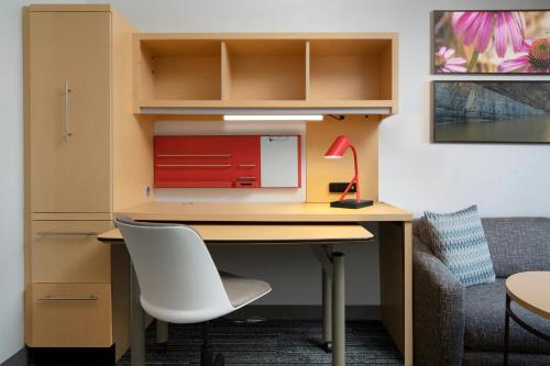an office with a desk with a chair and a lamp at TownePlace Suites by Marriott Laredo in Laredo