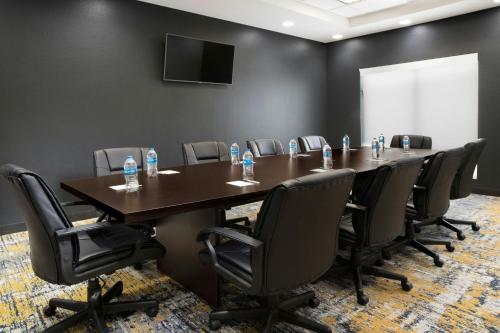 a conference room with a long table and chairs at TownePlace Suites by Marriott Laredo in Laredo