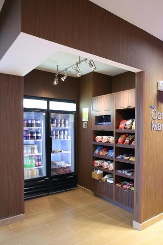 a store with an open refrigerator with food in it at Fairfield Inn & Suites by Marriott East Grand Forks in East Grand Forks