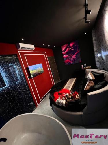 a bathroom with a tub and a sink and a bath tub at Mastery Hotel Nhà Bè in Ho Chi Minh City