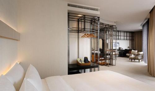 Postel nebo postele na pokoji v ubytování Orient Luxury Hotel-Jiaoxi
