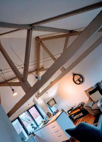 a room with wooden beams on the ceilings of a room at Contractor and Family friendly Grade II townhouse- 3 bedrooms- free parking in Norwich