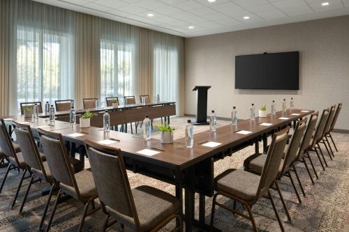a large conference room with a long table and chairs at Courtyard By Marriott Titusville Kennedy Space Center in Titusville