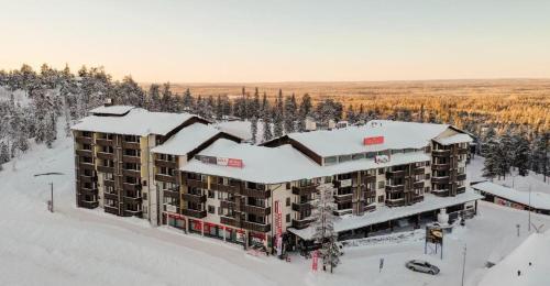 an aerial view of a hotel in the snow at Ruka Chalets Royal Apartments in Ruka
