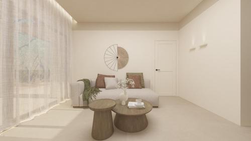 a living room with a couch and a table at The Yard Corfu Boutique Hotel and Spa in Corfu Town