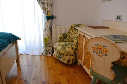 a room with a table and a chair and a desk at Casa Comana Boutique Hotel in Bucharest
