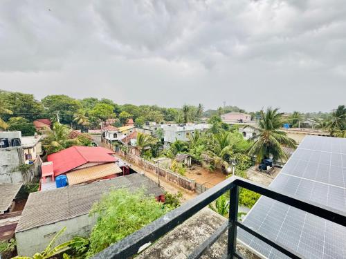 a view of a town with solar panels on the roofs at Trinco Town Family Guest House in Trincomalee